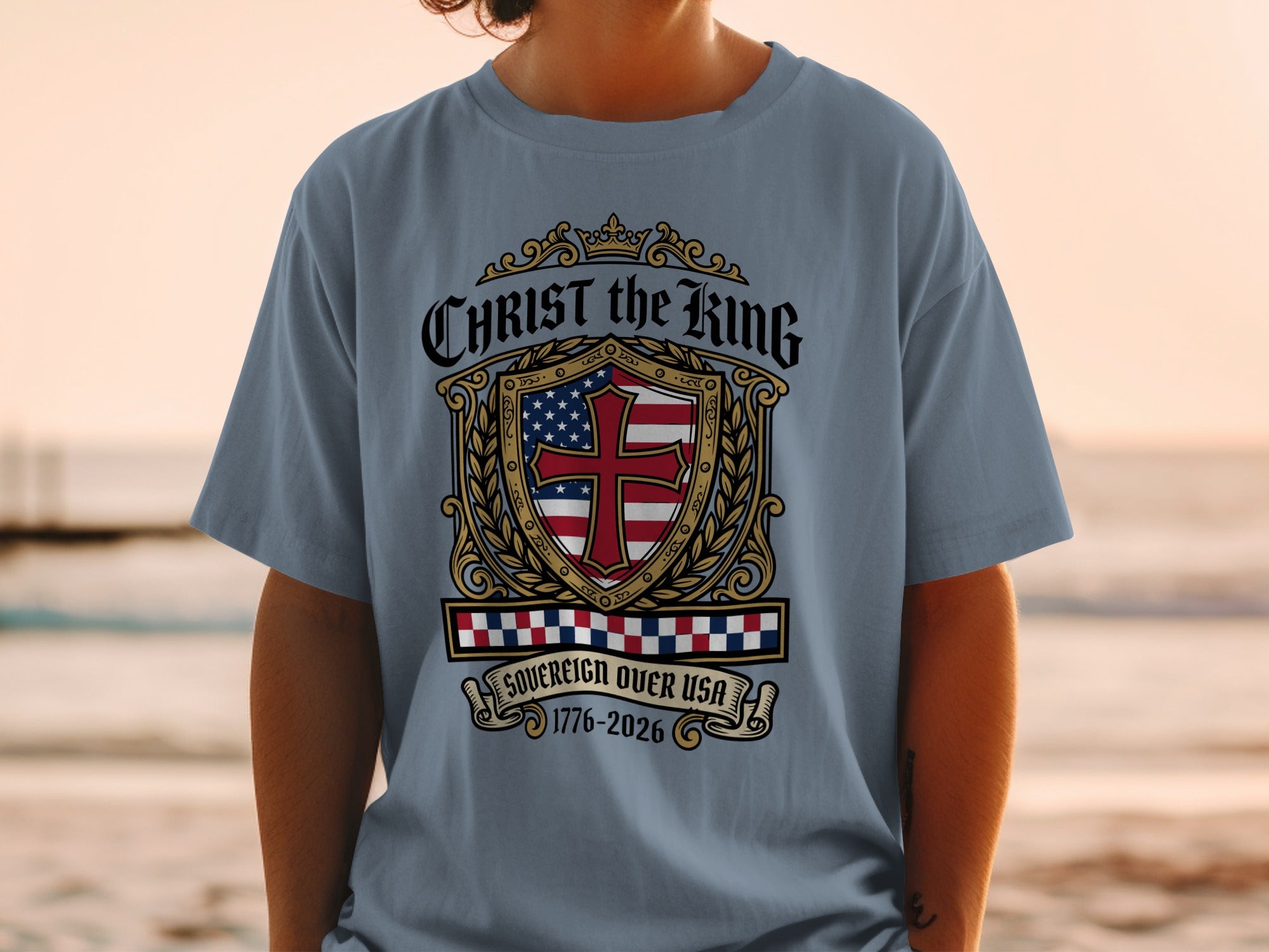 Shield with US flag, crown, and "Christ the King Sovereign Over USA 1776-2026".