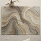 Abstract swirling pattern with gold cross on a placemat.