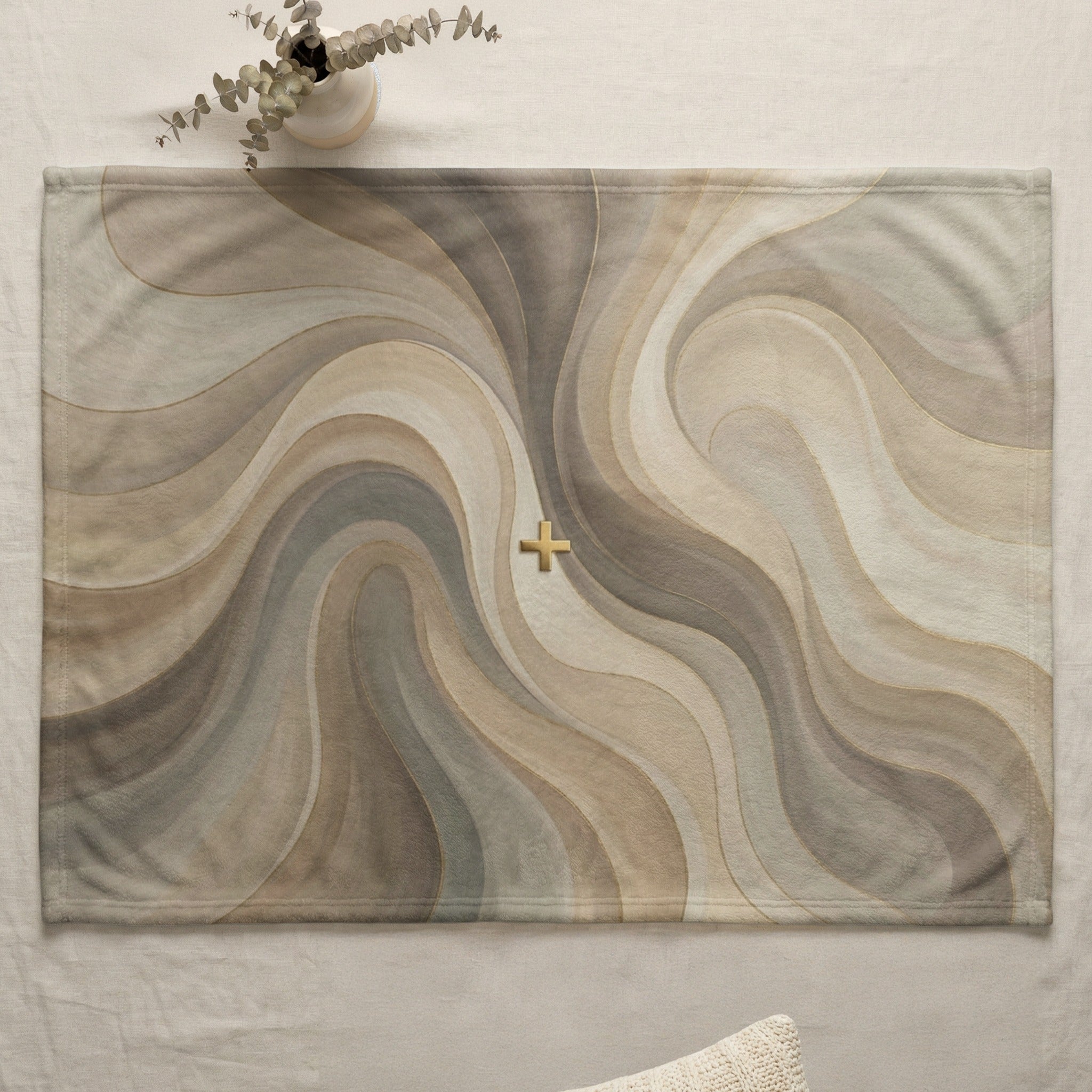 Abstract swirling pattern with gold cross on a placemat.