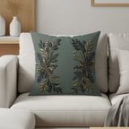 Dark green throw pillow with gold and dark green floral embellishments.