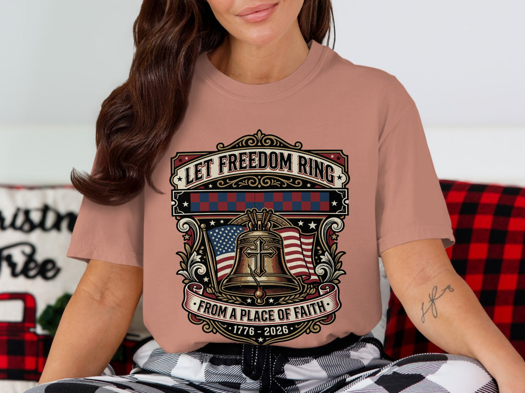 T-shirt with bell, flag, and "Let Freedom Ring From a Place of Faith" text.