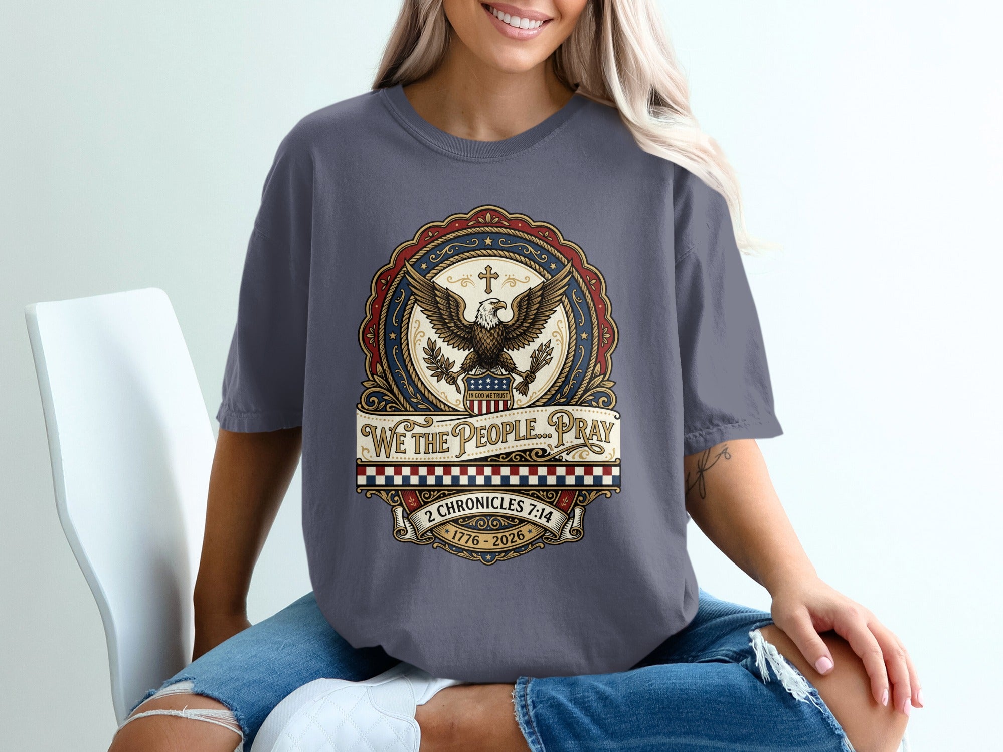 T-shirt with "We the People Pray" text, eagle, and patriotic emblem.