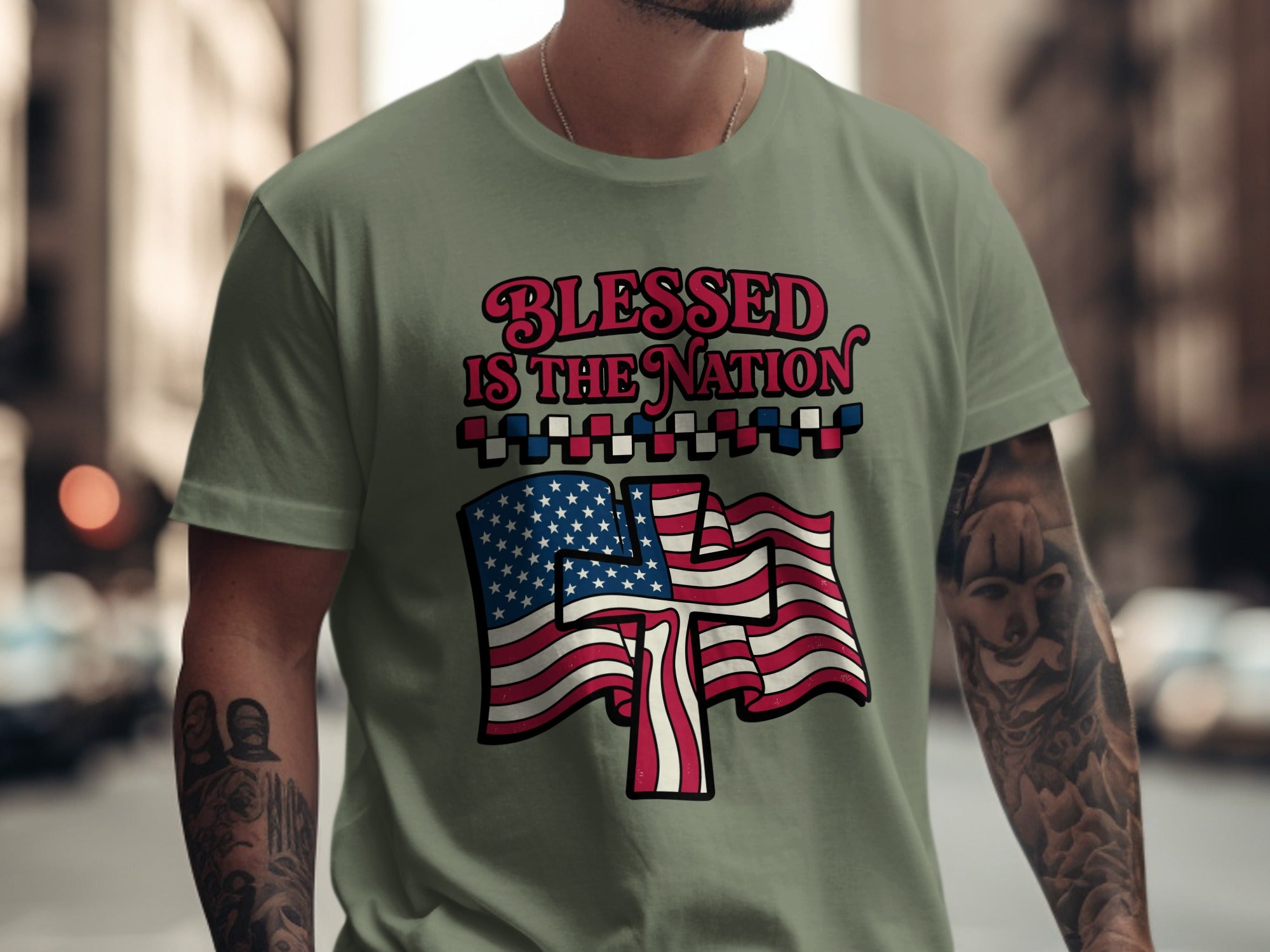 Green t-shirt with "Blessed Is The Nation" text and American flag.